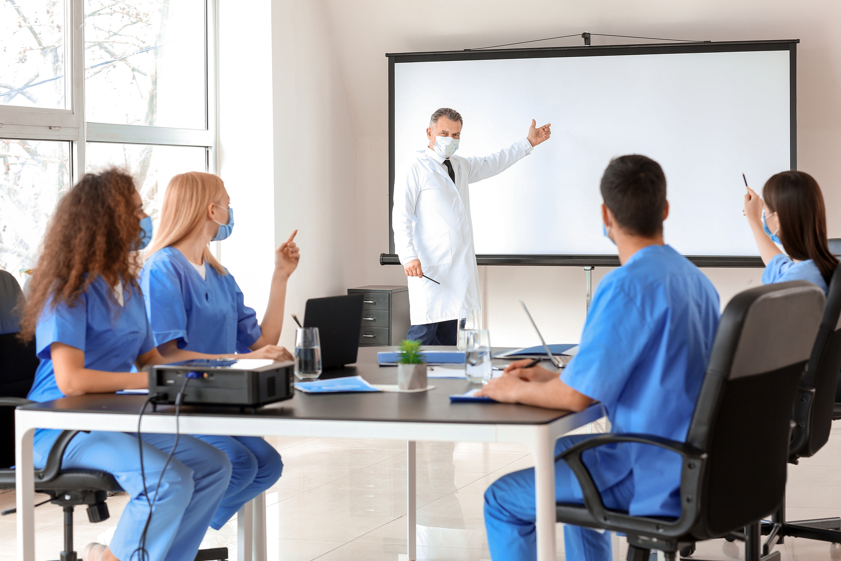 Male Lecturer Teaching Medical Students in University